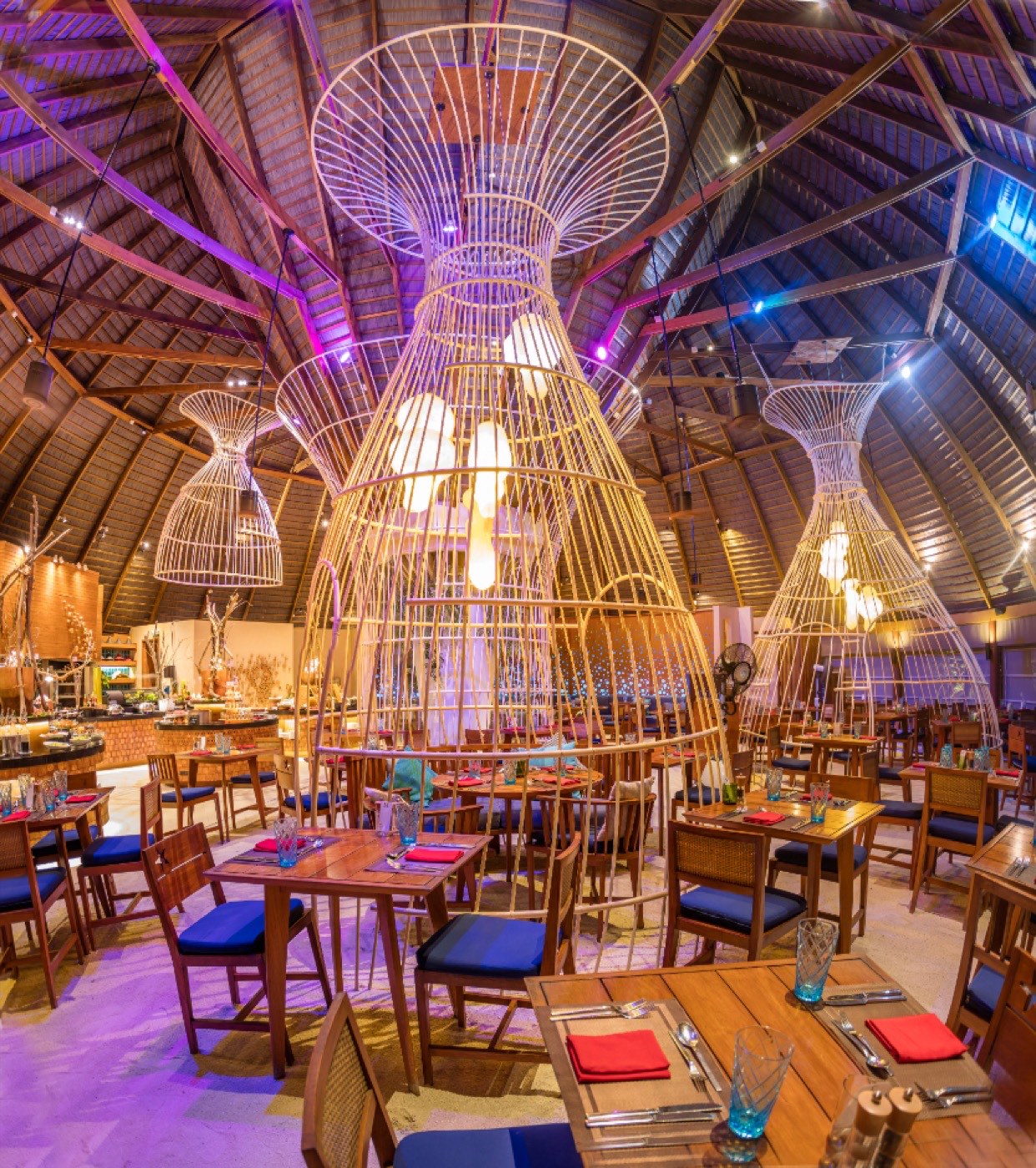 The Oceans restaurant, open-sided with timber tables beside the water.