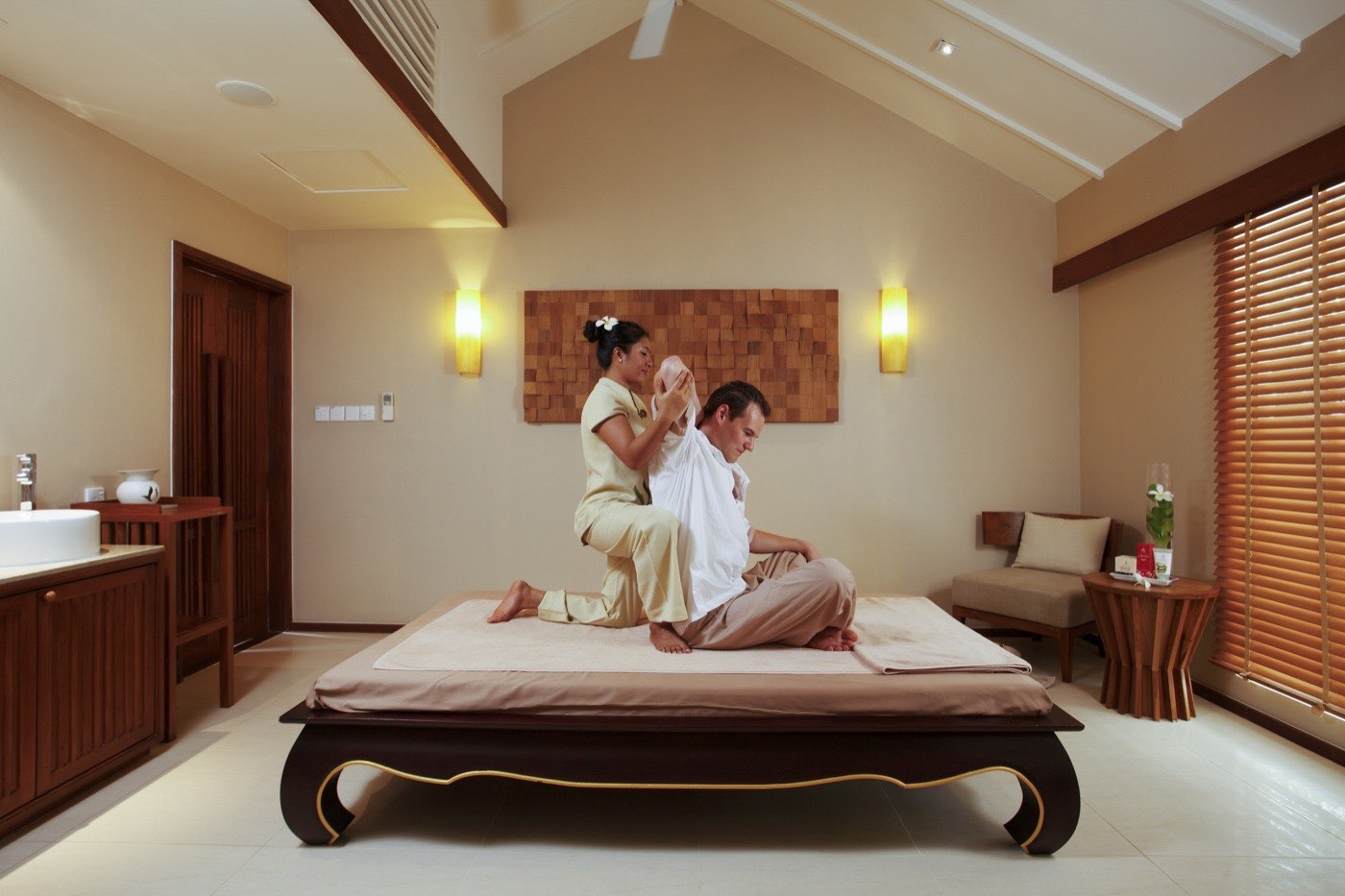 A Spa Cenvaree treatment room open to the sea, with twin massage beds.